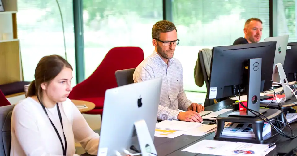 Stylized workplace photography for Sourcing Specialist mock interview context on MockitX (theme-matched Unsplash source)