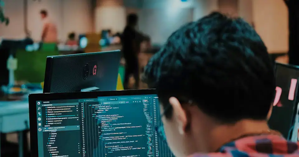 Stylized workplace photography for Vue Developer mock interview context on MockitX (theme-matched Unsplash source)